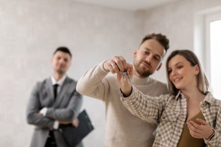 A couple holding the keys to their home