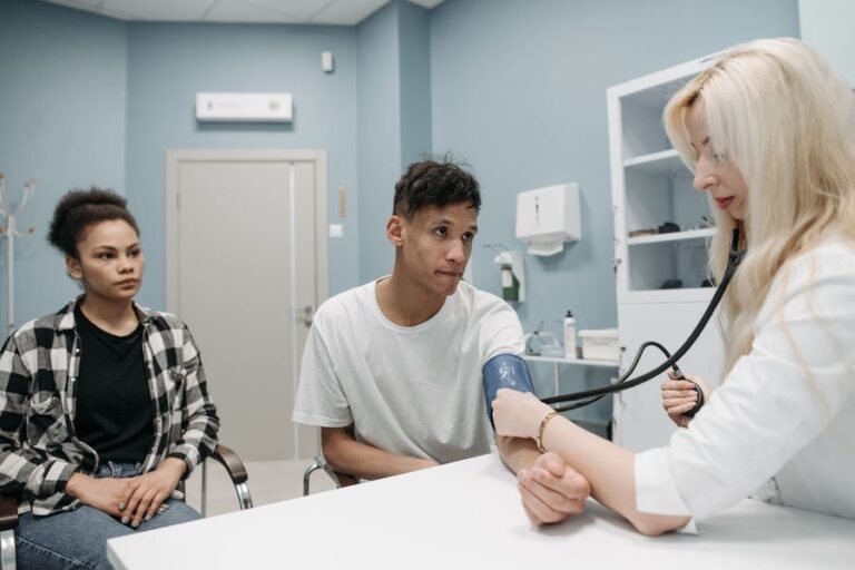 A doctor checking a patient's blood pressure